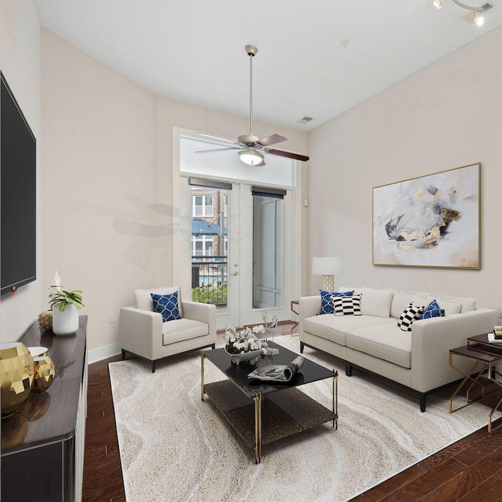 Contemporary neutral living space in apartment with high ceilings and warm wood floors