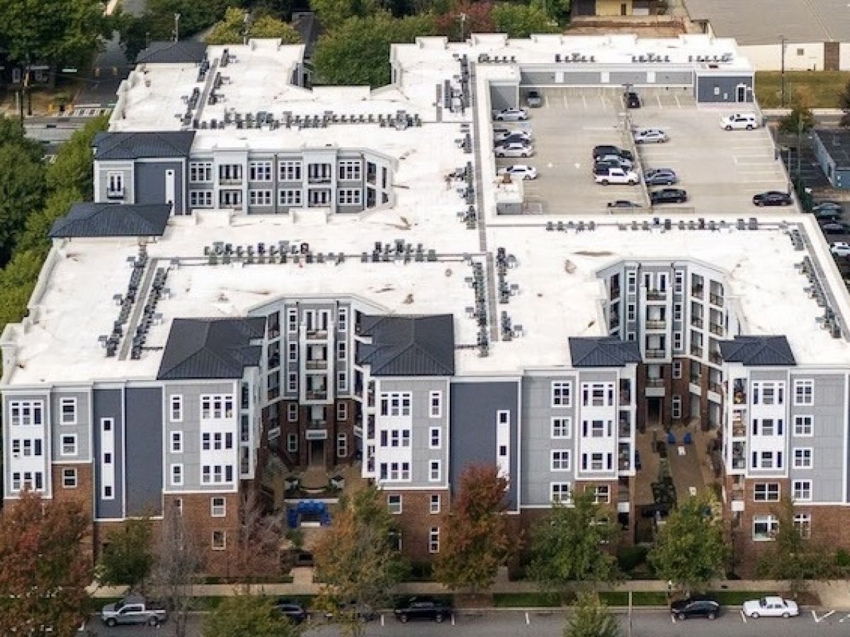 Aerial view of the Hawthorne 808 residential complex showing multiple apartment buildings and surrounding parking areas.