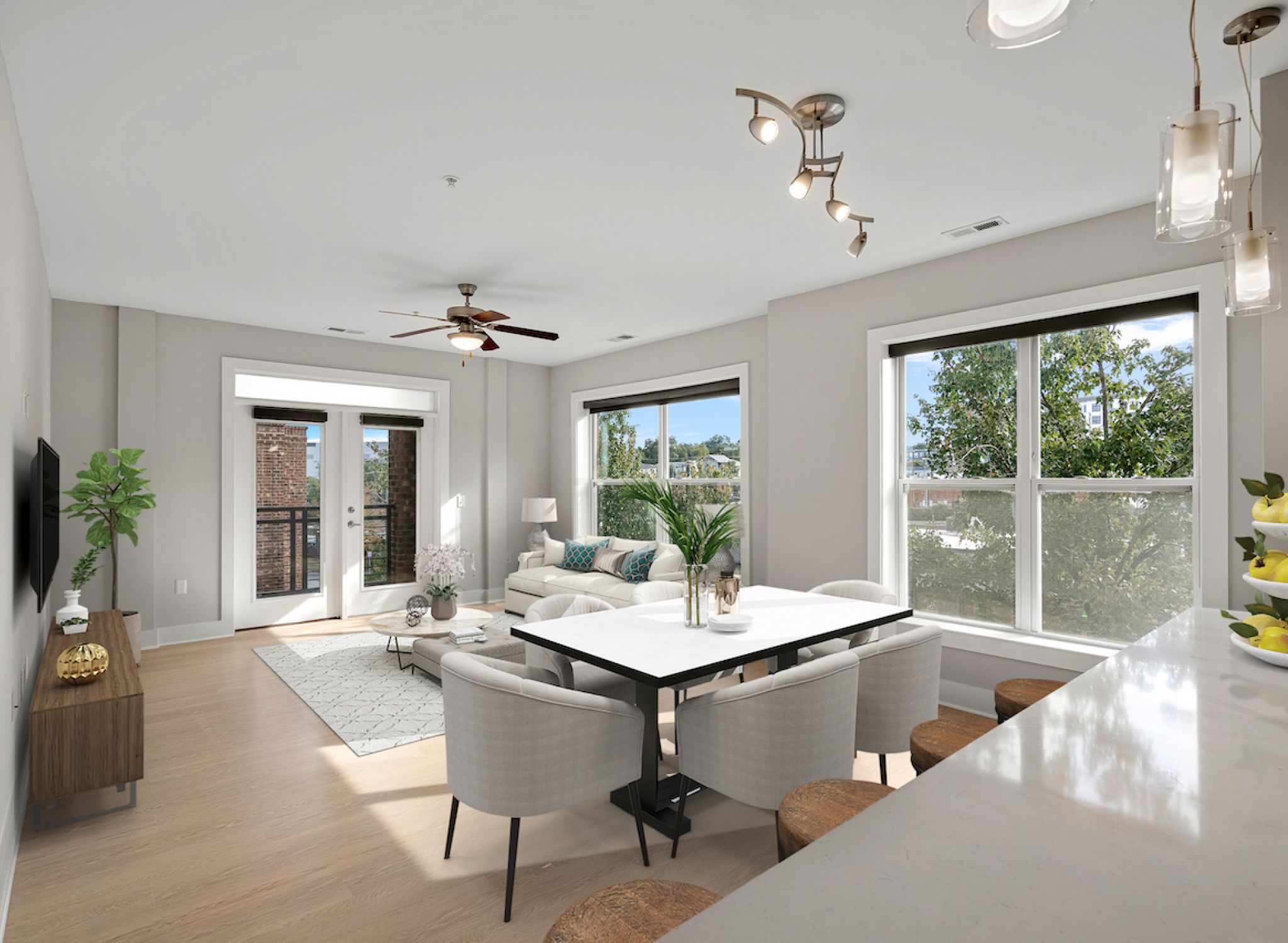 808 Hawthorne apartment living space with large patio doors and furnished with table, chairs, and couch